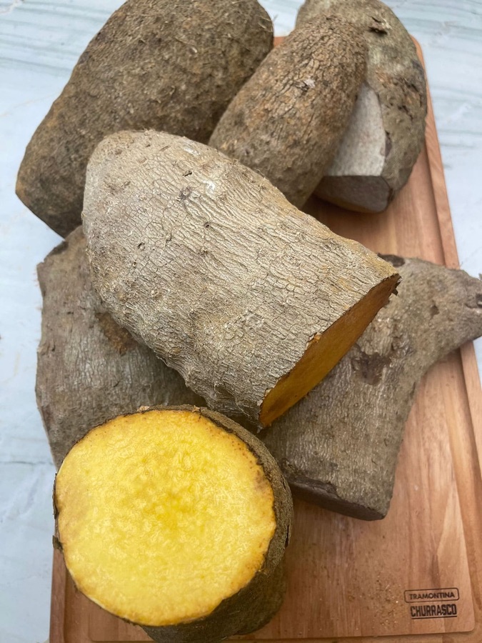 Yellow yam cut open to show its golden flesh